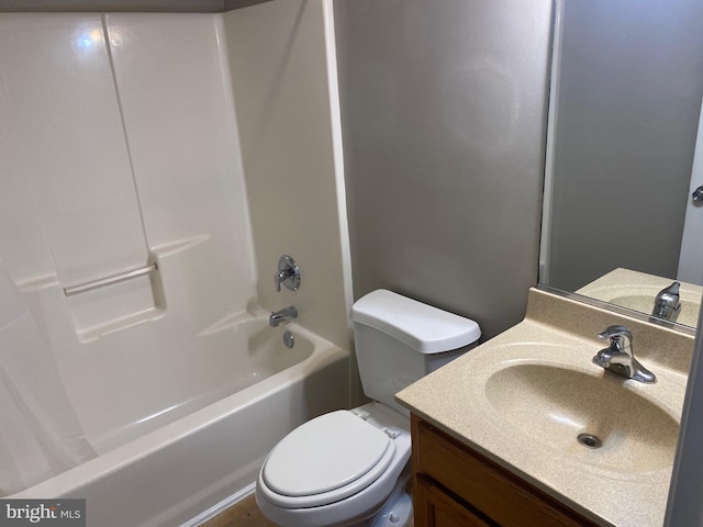 full bathroom featuring shower / bathing tub combination, vanity, and toilet