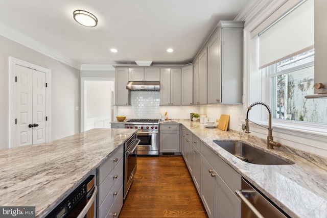 kitchen with light stone counters, gray cabinets, sink, and stainless steel appliances