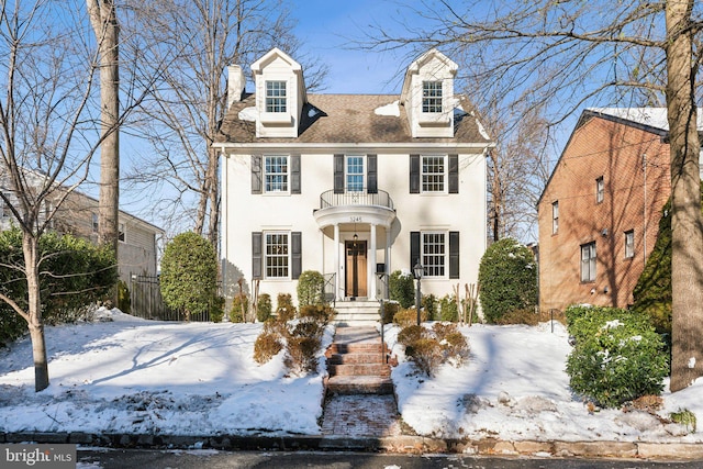 view of front of house featuring a balcony