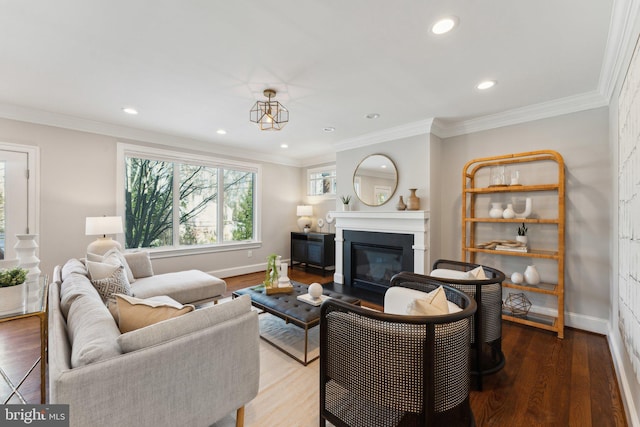 living room featuring hardwood / wood-style floors and crown molding