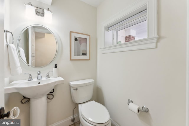 bathroom with sink and toilet