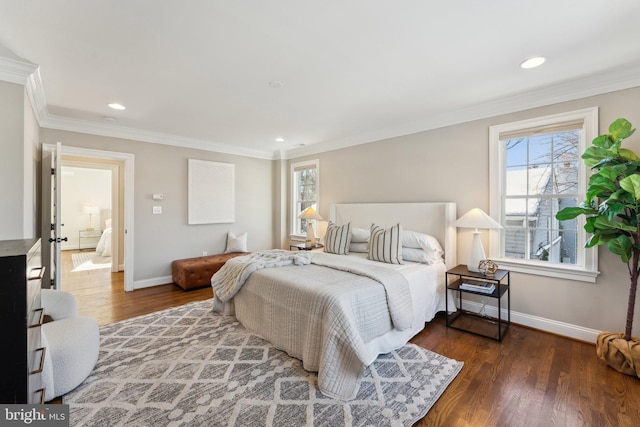 bedroom featuring crown molding and dark hardwood / wood-style flooring