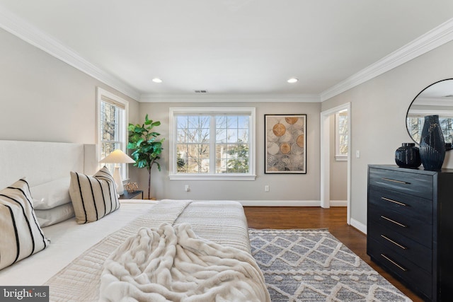 bedroom featuring crown molding and wood-type flooring