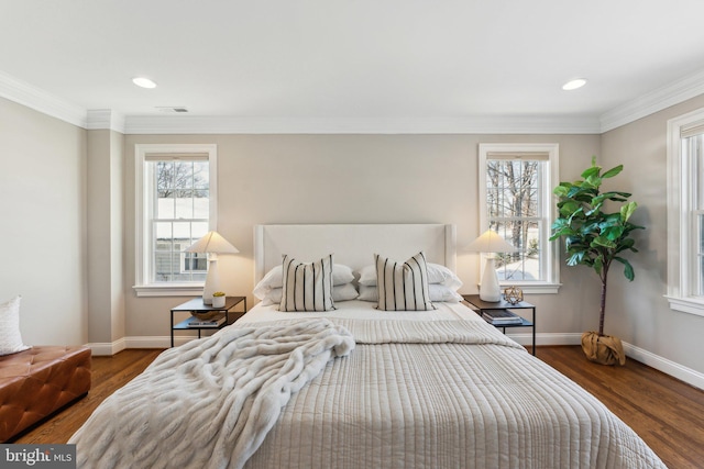 bedroom featuring crown molding and dark wood-type flooring