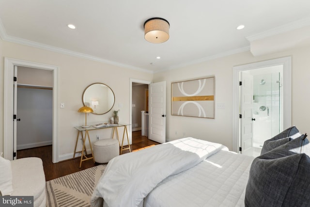 bedroom featuring ensuite bathroom, crown molding, and dark wood-type flooring