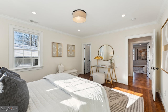 bedroom with dark wood-type flooring and ornamental molding