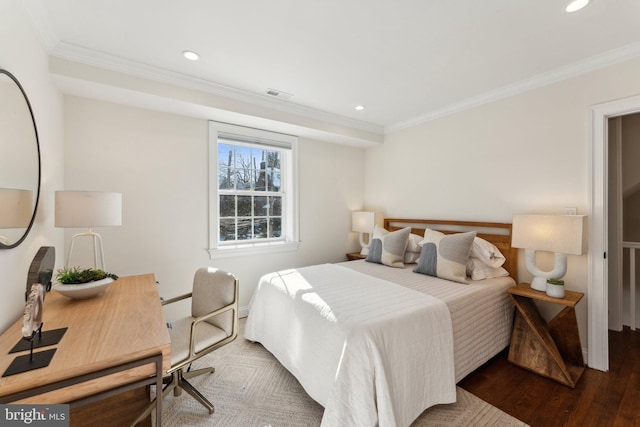 bedroom featuring hardwood / wood-style flooring and crown molding