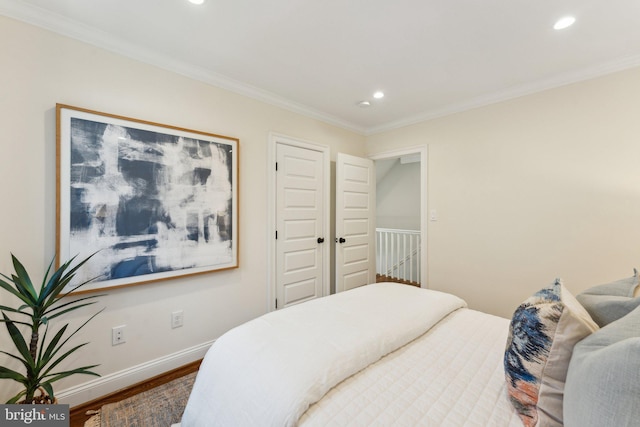 bedroom featuring wood-type flooring and crown molding