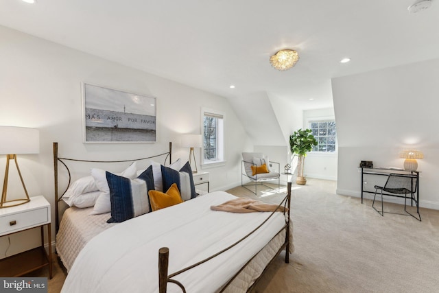 carpeted bedroom with vaulted ceiling