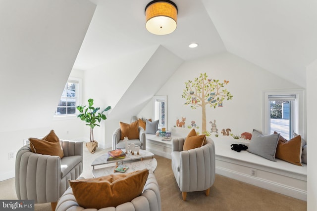 interior space featuring multiple windows, light carpet, and lofted ceiling