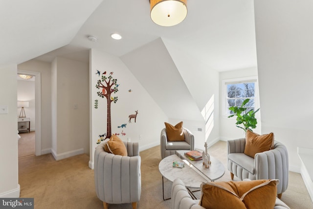 carpeted living room featuring lofted ceiling