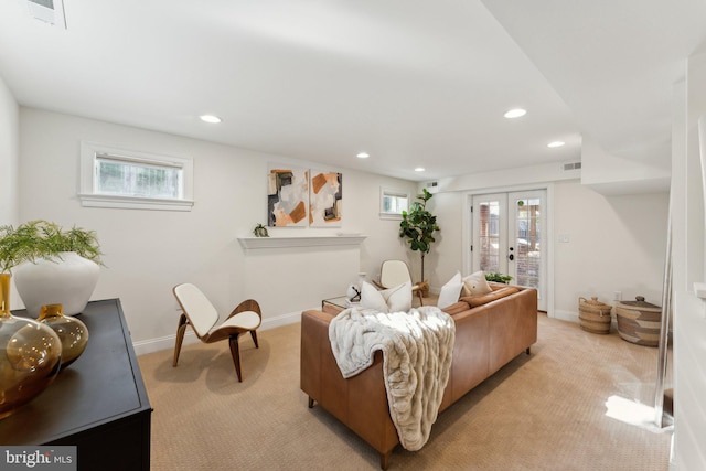 carpeted living room featuring french doors and plenty of natural light