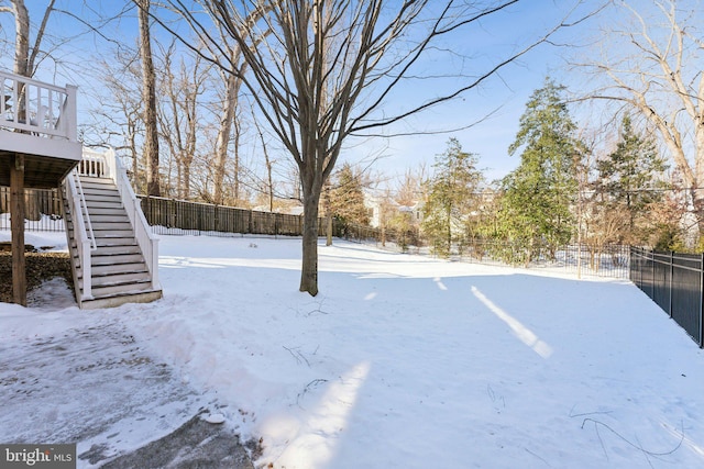 view of yard covered in snow