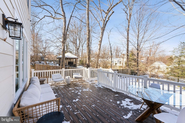 snow covered deck featuring an outdoor hangout area