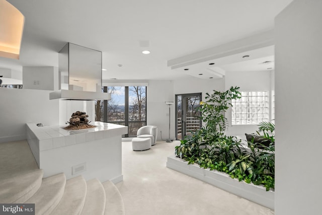 interior space with light carpet and tile counters