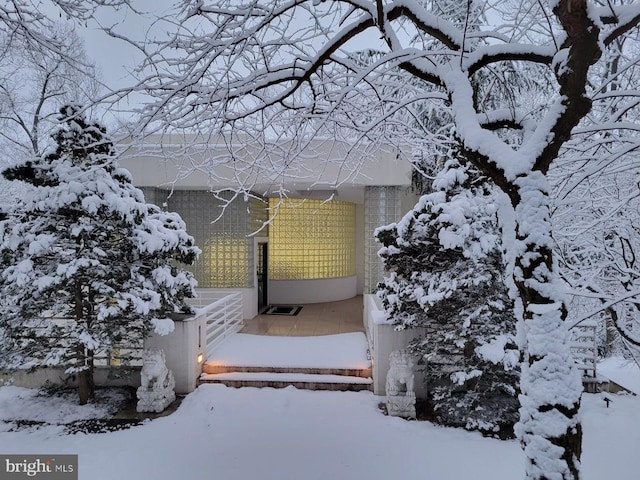 view of snow covered property