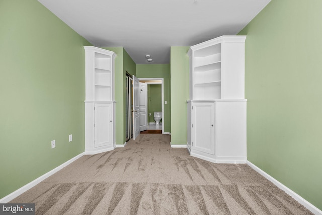 unfurnished bedroom with light colored carpet