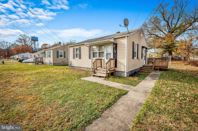 bungalow with a front yard