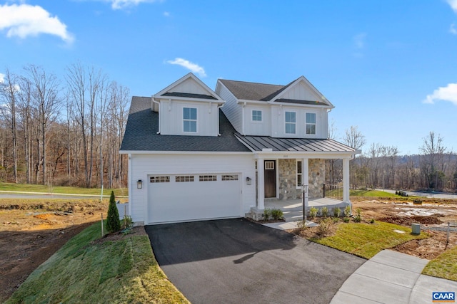 view of front of house with a porch and a garage