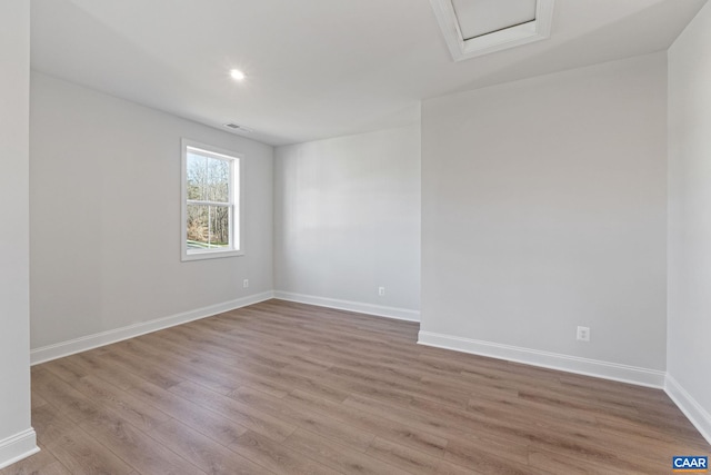 unfurnished room featuring light hardwood / wood-style flooring