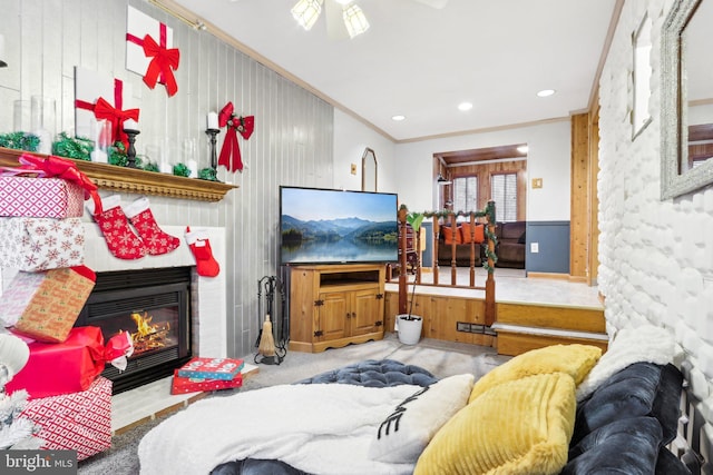 living room with crown molding and ceiling fan