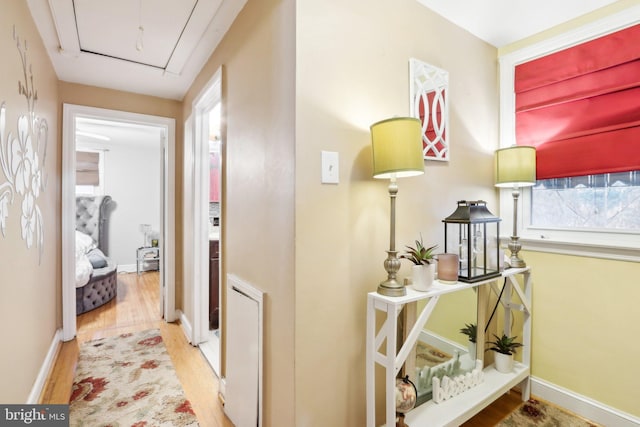 hall with light hardwood / wood-style floors