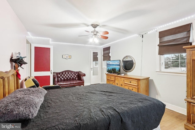 bedroom featuring ceiling fan and light hardwood / wood-style floors