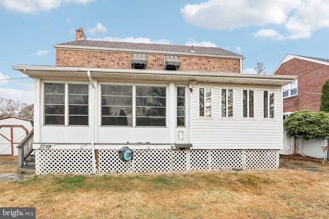 back of house with a yard