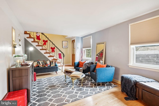 living area with hardwood / wood-style flooring