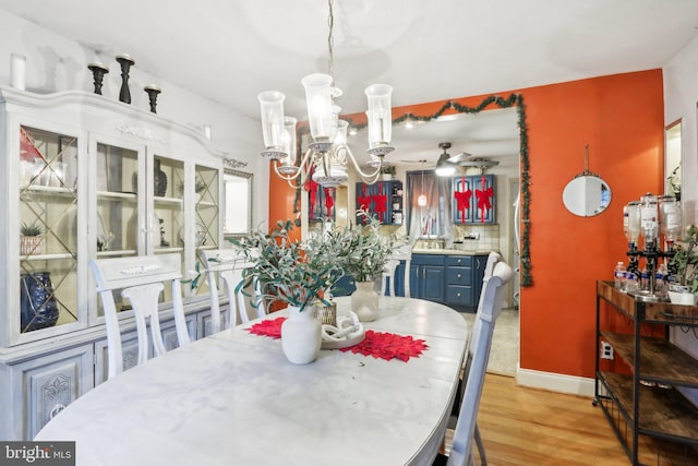 dining room featuring light hardwood / wood-style floors and ceiling fan