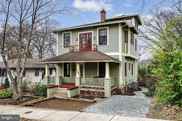 view of front of property with central AC unit and a porch