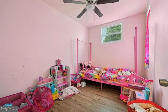 bedroom with ceiling fan and wood-type flooring