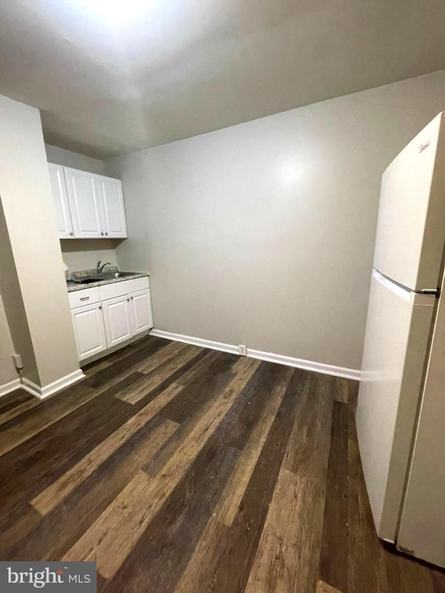 interior space with sink and dark hardwood / wood-style flooring