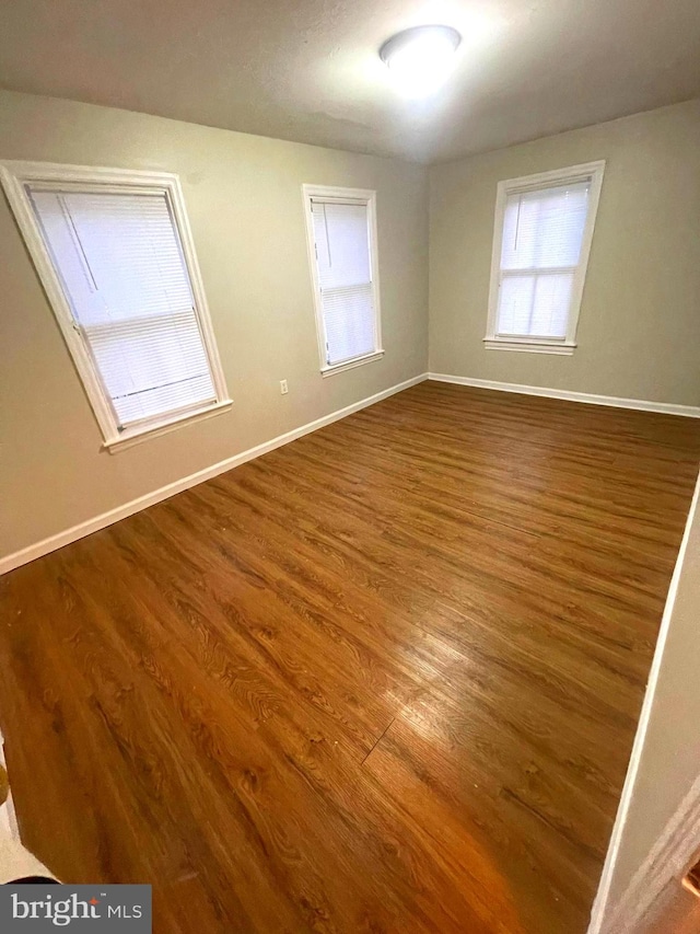 unfurnished room featuring wood-type flooring