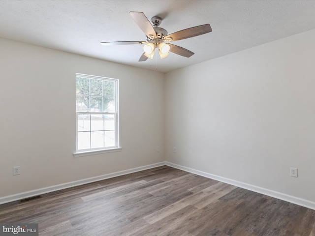 unfurnished room with hardwood / wood-style flooring and ceiling fan