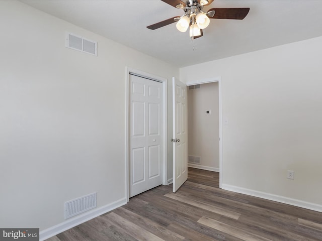 unfurnished room featuring ceiling fan and hardwood / wood-style flooring