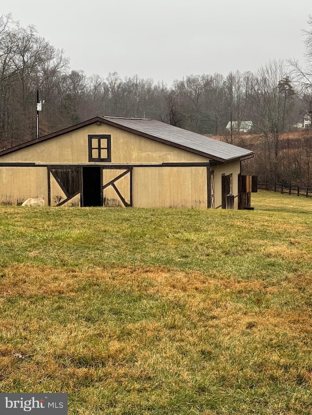 view of outdoor structure featuring a lawn