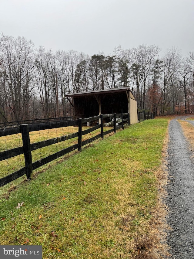 exterior space featuring an outbuilding and a rural view