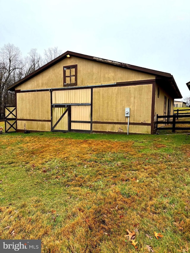 view of outdoor structure with a lawn