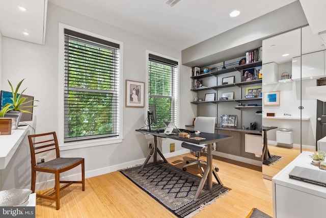 office area with light hardwood / wood-style flooring