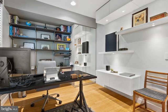 home office featuring light hardwood / wood-style floors