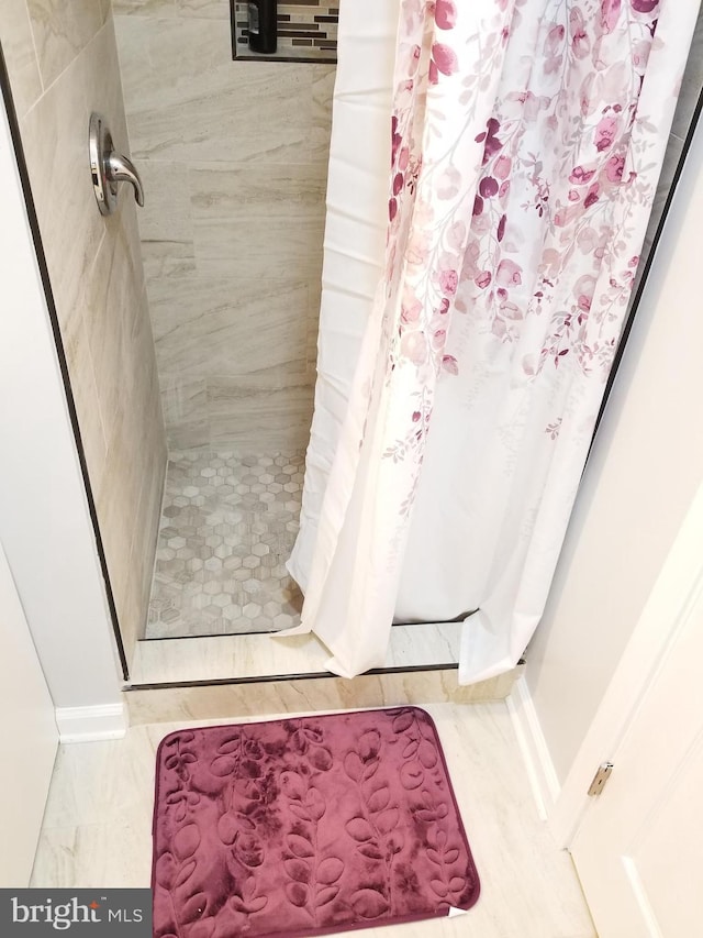 bathroom featuring walk in shower