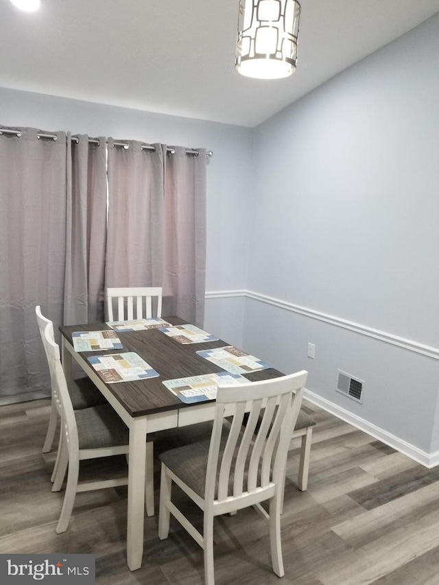 dining space featuring hardwood / wood-style floors