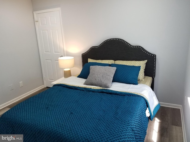 bedroom with wood-type flooring