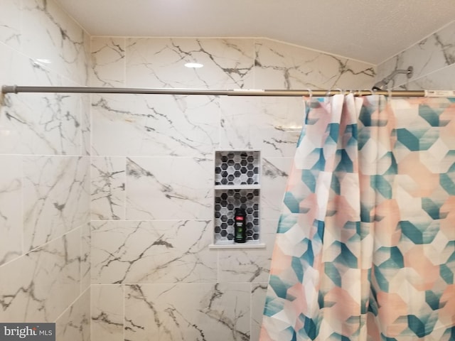 bathroom with a shower with curtain