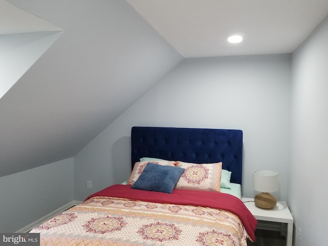 bedroom with lofted ceiling