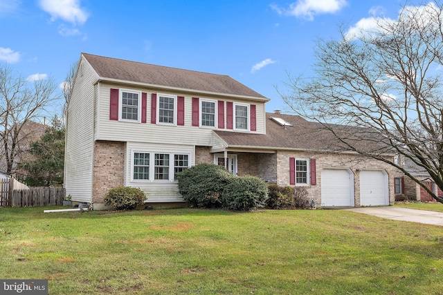 view of front of home with a front yard and a garage