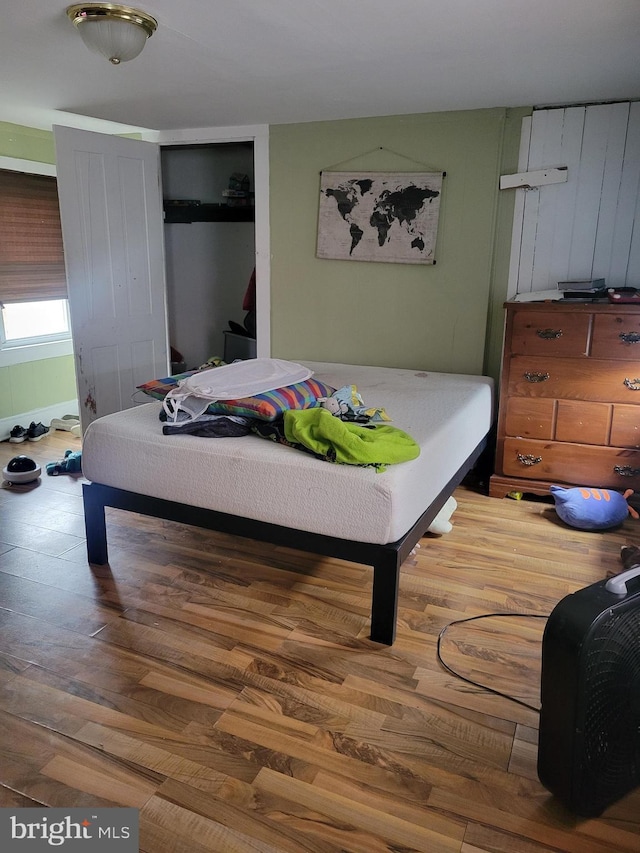 bedroom featuring wood-type flooring