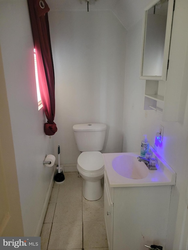 bathroom with tile patterned floors, vanity, and toilet