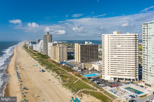 birds eye view of property with a view of the beach and a water view